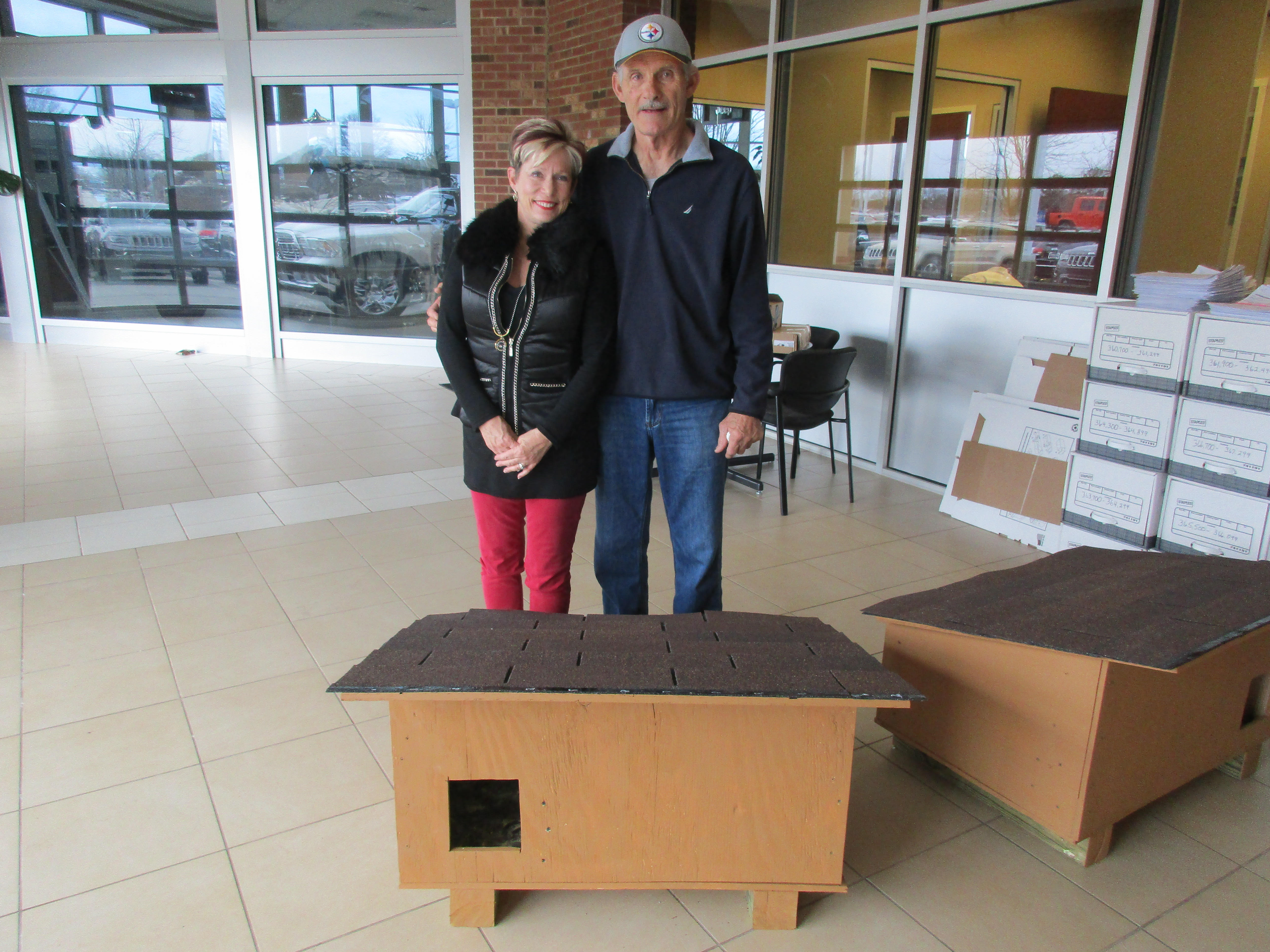 Robin Byrd (left), executive director of Lake Norman Lucky Cat, with Kitty Kottage builder  Jim Smith
