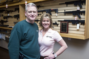 Principle owners Brian and Tricia Sisson pose for a portrait in the gun store area of The Range at Lake Norman.