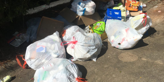 Trash continued to pile up over the weekend where dumpsters were removed and not replaced as the town switched waste service companies