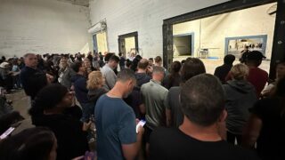 Parents wait at Foamex to pick up Bailey Middle students