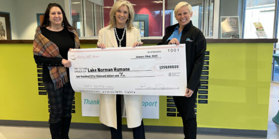 Robin Salzman, founder of Giving with Grace Foundation presents check to Lake Norman Humane’s Maria Roberson, treasurer and Dana Kelley, executive director 